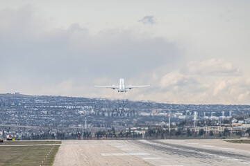 Airplane Jetliner departing at airport runway