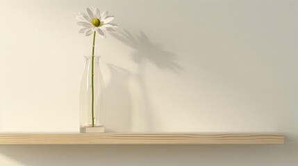 A single flower in a tall, clear vase placed on a simple shelf