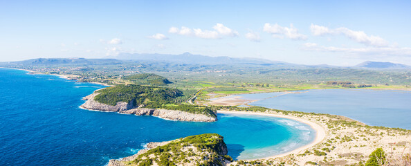 Aerial beautiful beach and water bay in the greek spectacular coast at half moon Voidokilia famous...