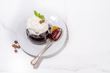 Coffee Jelly Dessert made with strong espresso coffee, gelatin or agar and whipped cream. Asian cold coffee sweets kohii zerii kanten on white table background copy space
