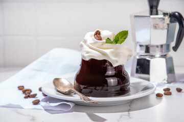 Coffee Jelly Dessert made with strong espresso coffee, gelatin or agar and whipped cream. Asian cold coffee sweets kohii zerii kanten on white table background copy space