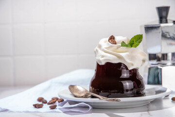 Coffee Jelly Dessert made with strong espresso coffee, gelatin or agar and whipped cream. Asian cold coffee sweets kohii zerii kanten on white table background copy space
