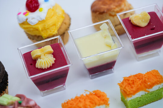 Dessert for afternoon Tea or High Tea , macaron, scone, cake, cup cakes in many color