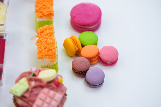 Dessert for afternoon Tea or High Tea , macaron, scone, cake, cup cakes in many color