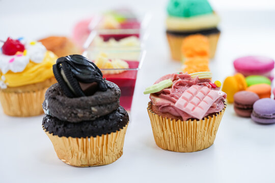 Dessert for afternoon Tea or High Tea , macaron, scone, cake, cup cakes in many color