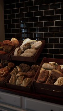 A busy bakery filled with various types of bread lining the store shelves.