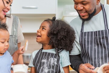 african afro black daughter kids with dad father and mom happy family funny for teach cooking....