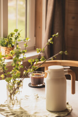morning coffee, thermos, white table, window, Nordic Scandinavian interior