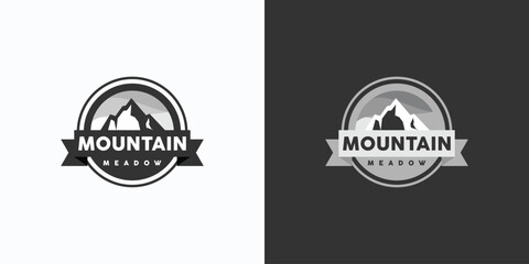 Mountain landscape emblem vector logo design with foggy background in modern, simple, clean and abstract style.