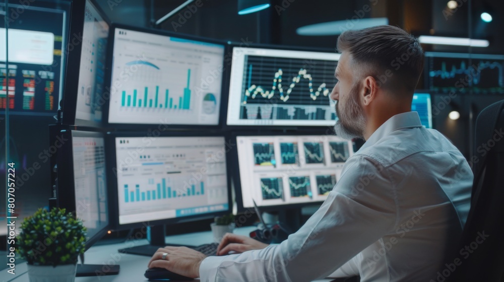 Aufkleber A businessman analyzing financial data on multiple computer screens, showcasing multitasking and analytical skills in modern business environments.
