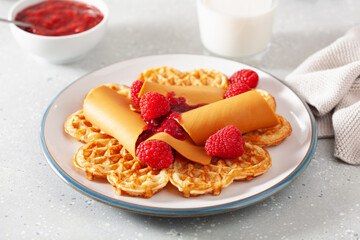 waffles with Norwegian brunost traditional brown cheese and raspberry jam