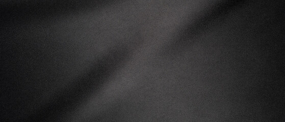 Close-Up View of a Black Fabric Texture in Soft Lighting