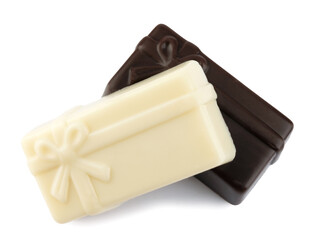 Two beautiful candies made of dark and white elite chocolate isolated on a white background. Art chocolate.