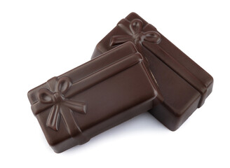 Two beautiful dark elite chocolate candies isolated on a white background. Art chocolate.