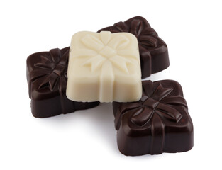  Beautiful candies made from elite white and dark chocolate isolated on a white background. Art chocolate.