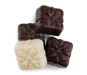 Beautiful candies made from elite white and dark chocolate isolated on a white background. Art chocolate.