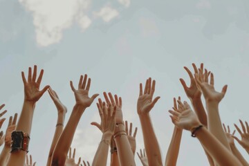 people's hands raised together in the air