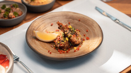 Healthy Mediterranean dishes at an open-air cafe table.