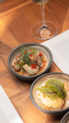 Healthy Mediterranean dishes at an open-air cafe table.