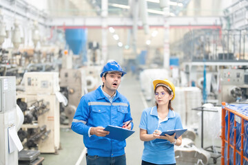 At the forefront of industrial innovation, the European male engineer and the Asian female engineer...