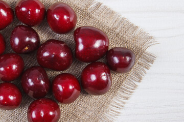 Fresh ripe cherries on jute cloth. Healthy dessert or snack