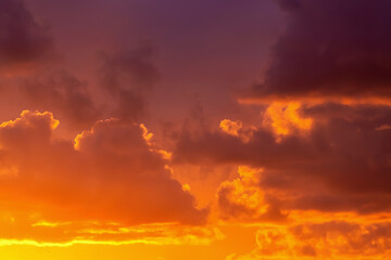 Stunning sunset sky with vibrant orange and purple clouds, backgrounds or wallpaper, nature themes.