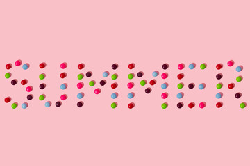 Creative design made of candies on a pink background. Minimal summer concept. 