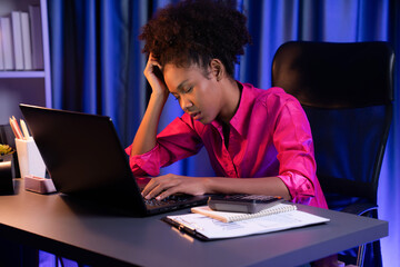 African woman freelancer feeling tried and take a nap on desk around by laptop and stationary,...
