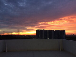 Enjoying sunset from top of a building