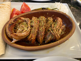 Kokorec Turkish Traditional Offal Food in Casserole served at Local Restaurant.