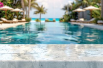 Naklejka premium Empty white marble stone table top and blurred swimming pool in tropical resort in summer banner background , for display products