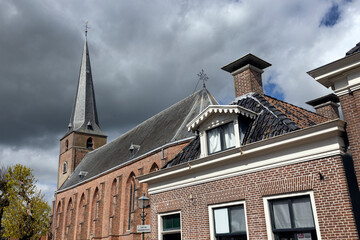 Church and houses at Kollum. Village at Dutch countryside. Kollum Friesland Netherlands. 