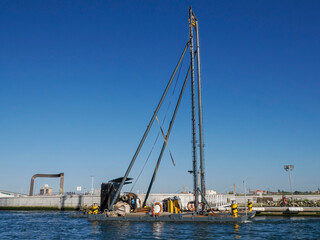 Fototapeta premium dredge of saline in salt ponds of Aveiro pictoresque village street view, The Venice Of Portugal