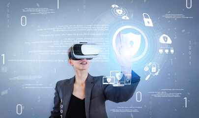 Business woman pointing and accessing at security protection system while using visual reality...