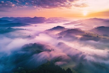 Fototapeta premium KSBeautiful misty valley at sunrise aerial view of mount