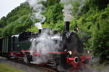 old steam train engine while running