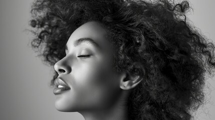 Beautiful african american woman with curly hair. Studio shot.