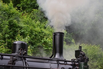 old steam train engine while running