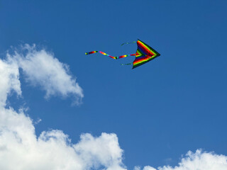 Kite flying in the sky clouds 