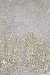 Exposed aggregate concrete surface texture. Flat lay composition for design and print.