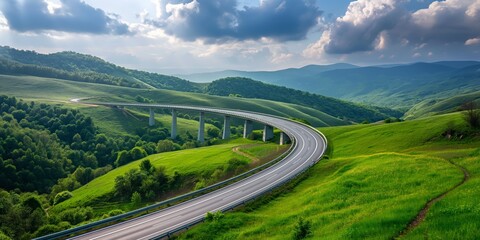 A picturesque highway bends through the rolling green hills, representing travel and beautiful landscapes