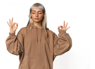 Young caucasian young woman in studio relaxes after hard working day, she is performing yoga.