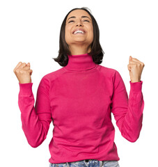 Young Caucasian woman with short hair celebrating a victory, passion and enthusiasm, happy expression.