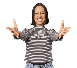 Young Caucasian woman with short hair feels confident giving a hug to the camera.