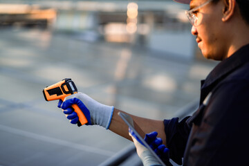 A person is holding a device that looks like a gun. The person is wearing gloves. The device is...