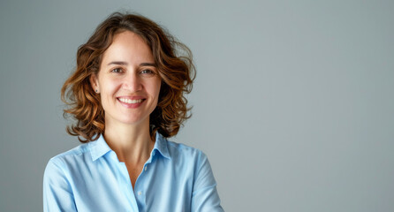 Fototapeta premium Photo of Smiling businesswoman in blue shirt 