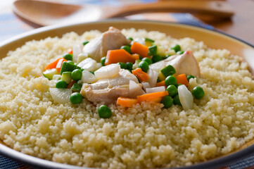 macro view of couscous with chicken and vegetables