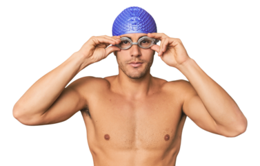 Close-up of Hispanic male swimmer with goggles, winner's attitude