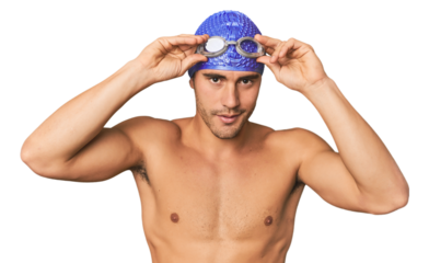 Close-up of Hispanic male swimmer with goggles, winner's attitude