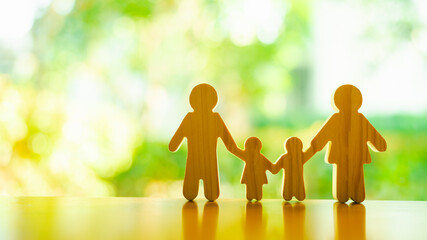 Family symbol with parents and children on hands of insurance agent looking out window view with...